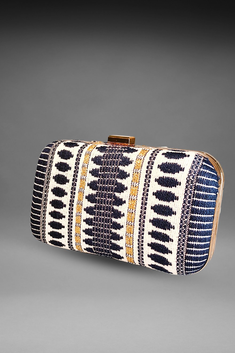 black and white threadwork clutch