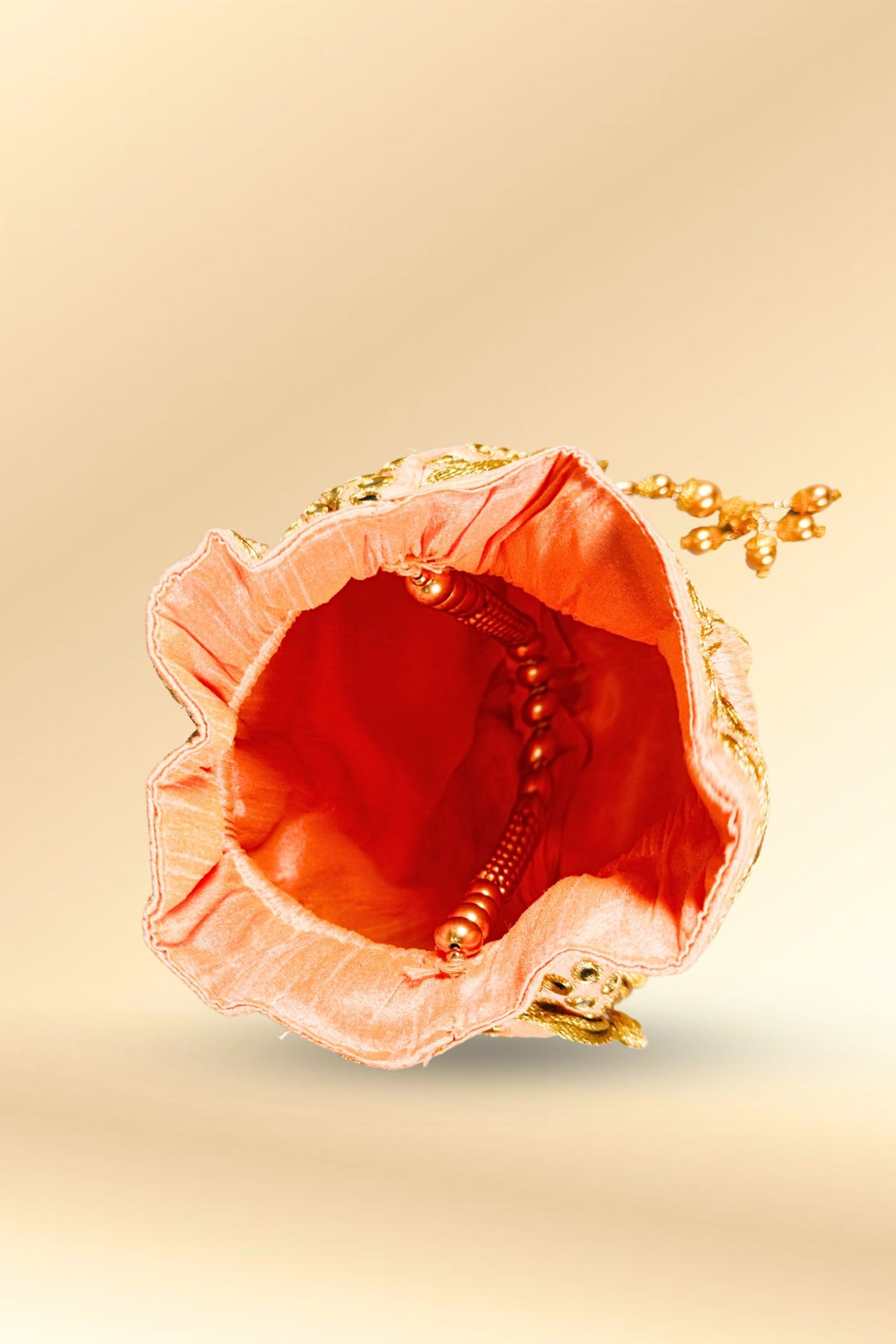 peach mirror work potli bag